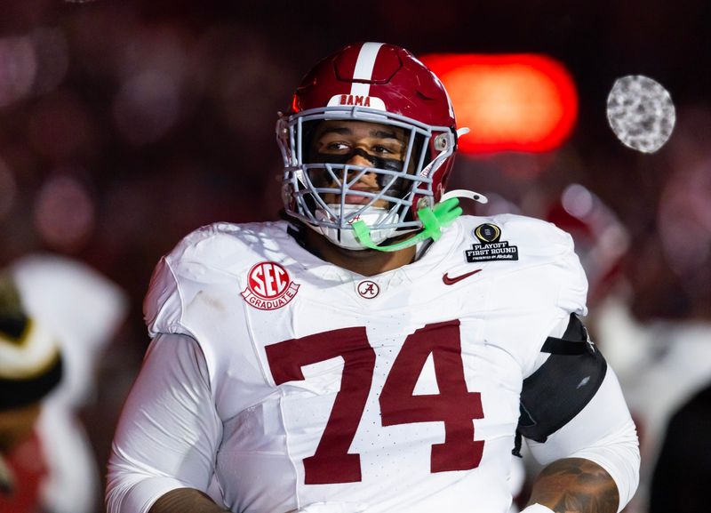Dec 19, 2025; Norman, OK, USA; Alabama Crimson Tide offensive lineman Kadyn Proctor (74) against the Oklahoma Sooners during the CFP National Playoff First Round at Gaylord Family Oklahoma Memorial Stadium. Mandatory Credit: Mark J. Rebilas-Imagn Images