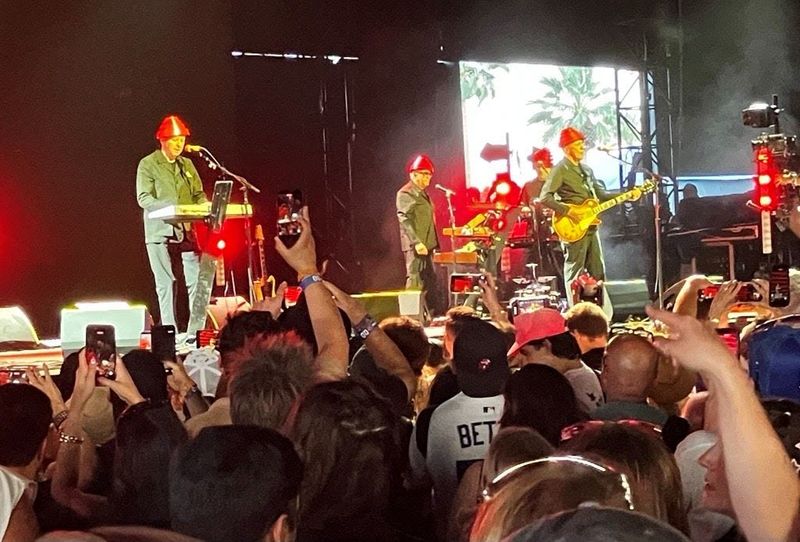Devo performs at the Coachella Valley Music & Arts Festival wearing their signature red hats known as "Power Domes" on Friday, April 10, 2026.