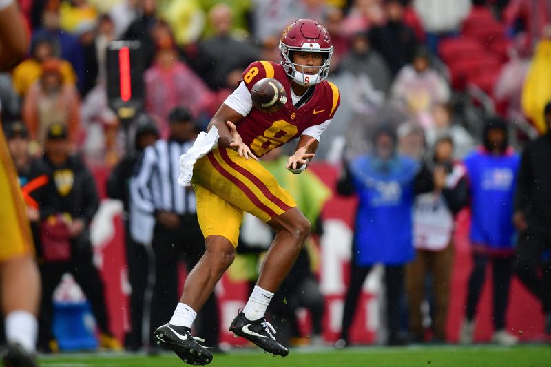 Nov 15, 2025; Los Angeles, California, USA; Southern California Trojans wide receiver Ja'Kobi Lane (8) catches a pass against the Iowa Hawkeyes during the first half at the Los Angeles Memorial Coliseum. Mandatory Credit: Gary A. Vasquez-Imagn Images