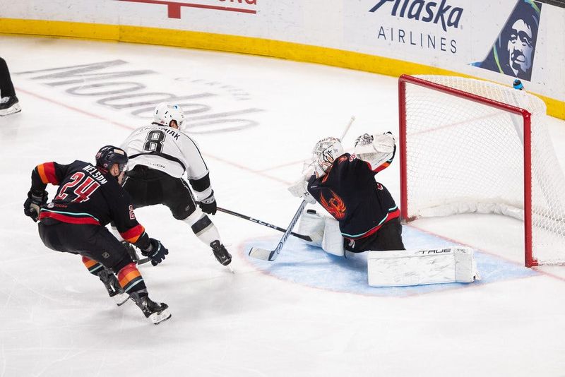 Coachella Valley Firebirds goalie Logan Terness blocks a shot by Martin Chromiak of the Ontario Reign on Saturday, April 11, 2026 inside Acrisure Arena in Palm Desert, California.