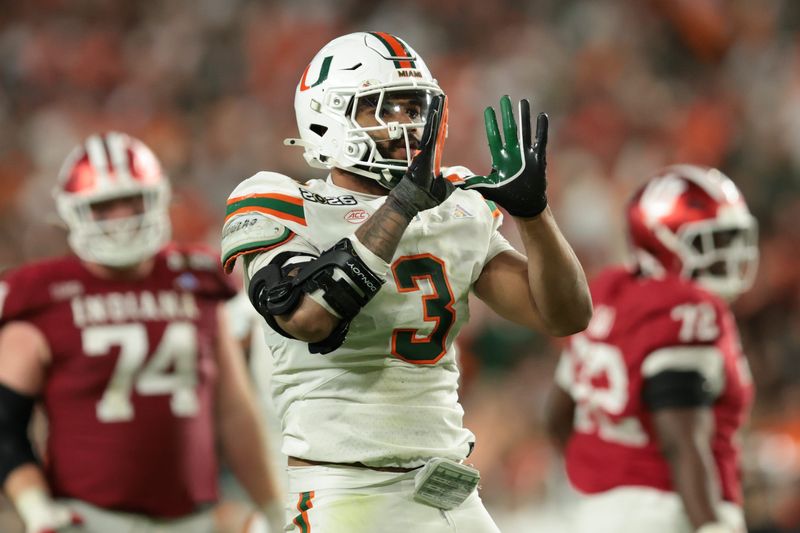 Jan 19, 2026; Miami Gardens, FL, USA; Miami Hurricanes defensive lineman Akheem Mesidor (3) celebrates after a sack against the Indiana Hoosiers in the third quarter during the College Football Playoff National Championship game at Hard Rock Stadium. Mandatory Credit: Sam Navarro-Imagn Images