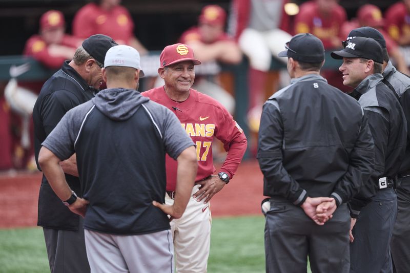 May 31, 2025; Corvallis, OR, USA; USC head coach Andy Stankiewicz visits with official before a game against Saint Mary's at the NCAA Corvallis Regional at Goss Stadium. Mandatory Credit: Troy Wayrynen-Imagn Images