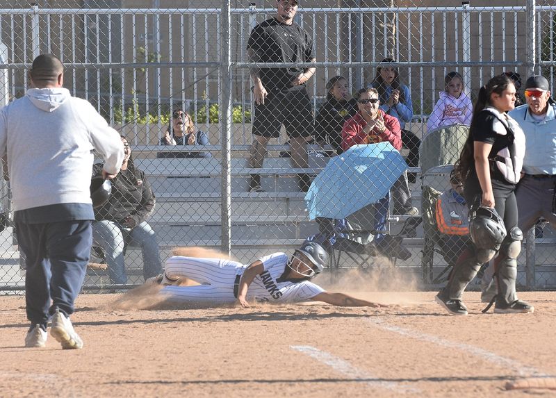 Silverado's Victoria Patino slides into home to score the game-winning run a 9-8 victory over Adelanto on Tuesday, April 14, 2026.