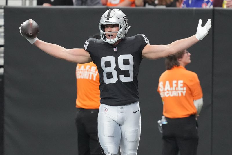 Dec 7, 2025; Paradise, Nevada, USA; Las Vegas Raiders tight end Brock Bowers (89) reacts after catching a touchdown against the Denver Broncos during the first half at Allegiant Stadium. Mandatory Credit: Kirby Lee-Imagn Images