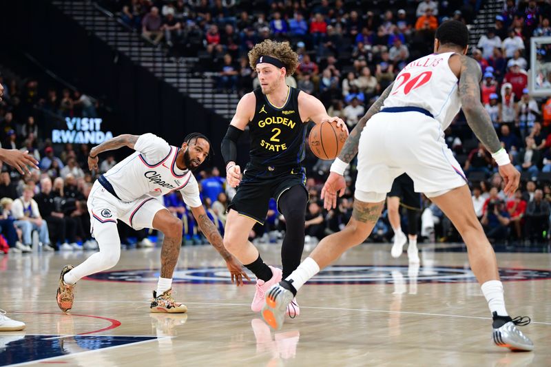 Apr 12, 2026; Inglewood, California, USA; Golden State Warriors guard Brandin Podziemski (2) moves the ball against Los Angeles Clippers forward Derrick Jones Jr. (5) and forward John Collins (20) during the first half at Intuit Dome. Mandatory Credit: Gary A. Vasquez-Imagn Images