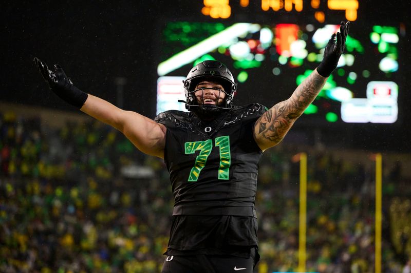 Oct 25, 2025; Eugene, Oregon, USA; Oregon Ducks offensive lineman Alex Harkey (71) celebrates after a touchdown during the second half against the Wisconsin Badgers at Autzen Stadium. Mandatory Credit: Troy Wayrynen-Imagn Images
