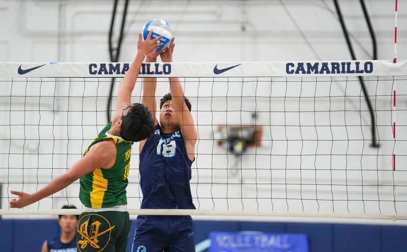 Camarillo High outside hitter Stanley Filiaga (18) blocks a Moorpark player during a Coastal Canyon League victory for the Scorpions on Tuesday, April 14, 2026, at Camarillo High.