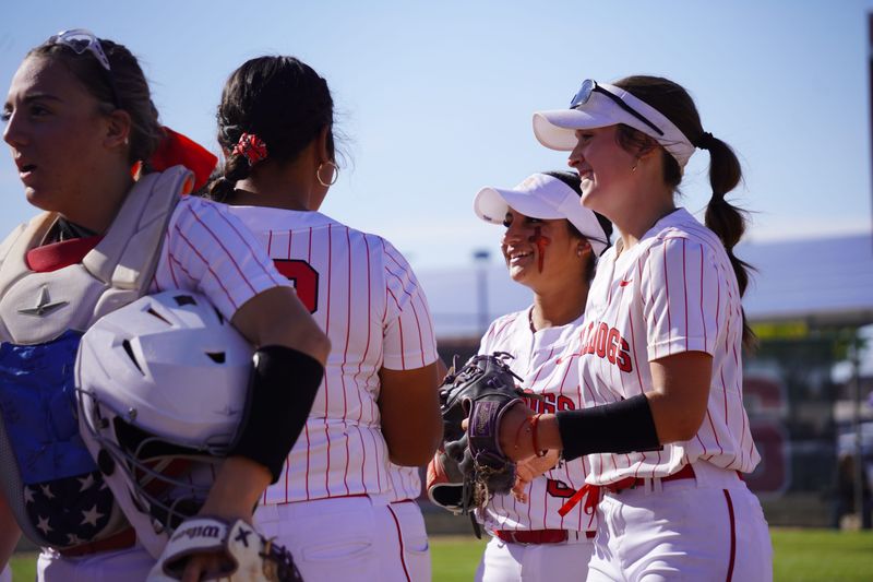 Oak Hills players celebrate after Dallyse York recorded an out on Wednesday, April 15, 2026. Apple Valley beat Oak Hills 16-13 in a battle for first place in the Mojave River League standings.