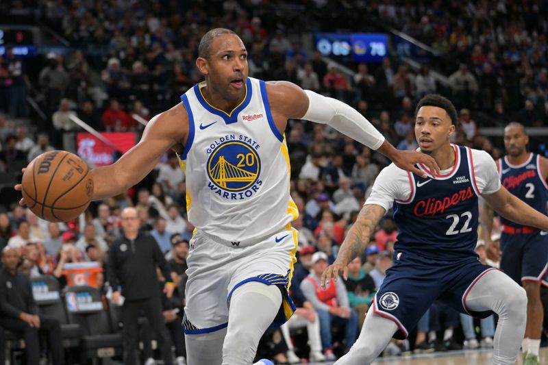 Apr 15, 2026; Inglewood, California, USA; Golden State Warriors center Al Horford (20) reaches in front of Los Angeles Clippers guard Jordan Miller (22) for a loose ball in the second half during the play-in rounds of the 2026 NBA Playoffs at Intuit Dome. Mandatory Credit: Jayne Kamin-Oncea-Imagn Images