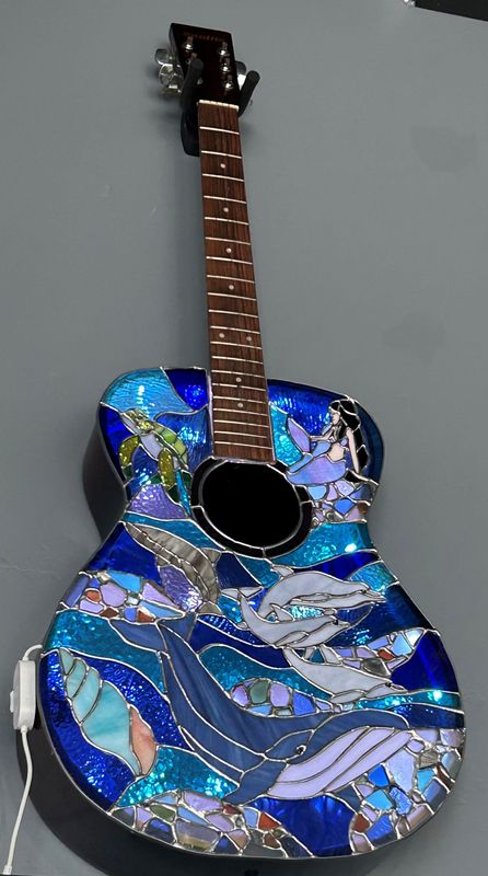 A stained-glass guitar at Shards & Thorns, a new business opening in June 2026 in downtown Redding.