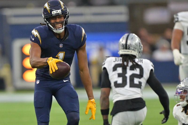 Nov 30, 2025; Inglewood, California, USA; Los Angeles Chargers wide receiver Quentin Johnston (1) reacts after a catch against the Las Vegas Raiders during the second half at SoFi Stadium. Mandatory Credit: Jayne Kamin-Oncea-Imagn Images