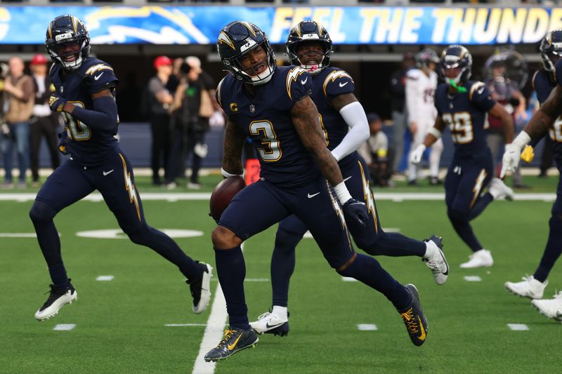Dec 27, 2025; Inglewood, California, USA; Los Angeles Chargers safety Derwin James Jr. (3) reacts with teammates after making an interception against the Houston Texans during the first half at SoFi Stadium. Mandatory Credit: Kiyoshi Mio-Imagn Images