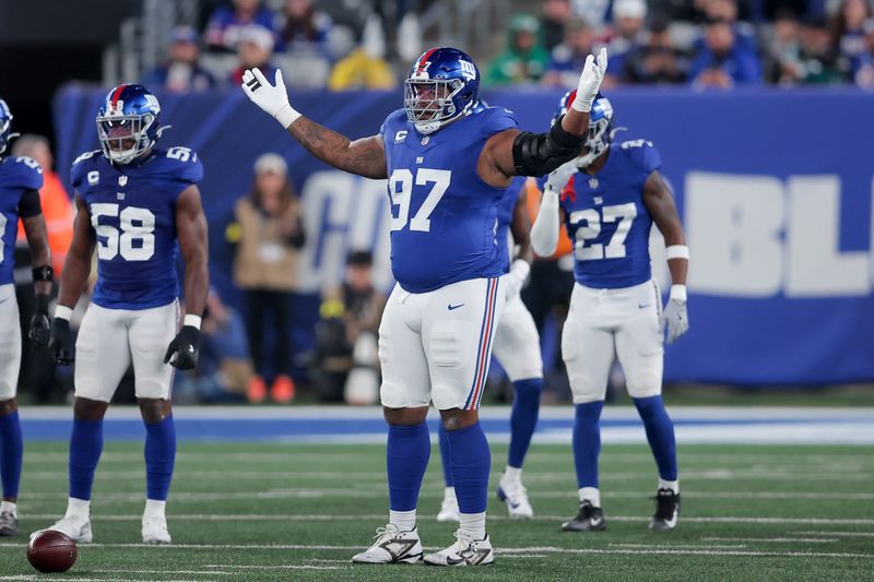 Oct 9, 2025; East Rutherford, New Jersey, USA; New York Giants defensive tackle Dexter Lawrence II (97) guestures during the first quarter of the game against the Philadelphia Eagles at MetLife Stadium. Mandatory Credit: Brad Penner-Imagn Images