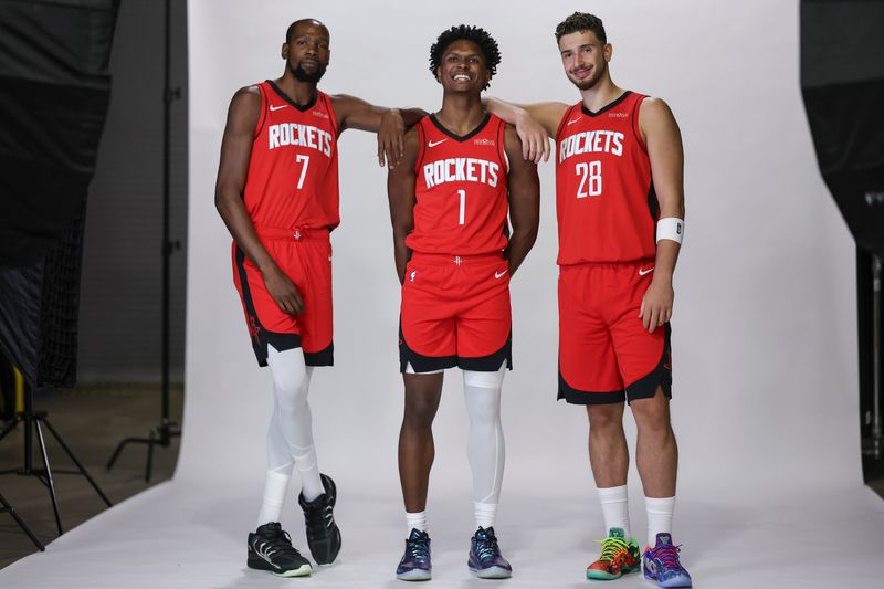 Sep 29, 2025; Houston, TX, USA; Houston Rockets forward Kevin Durant (7) and forward Amen Thompson (1) and center Alperen Sengun (28) during Houston Rockets media day at Toyota Center. Mandatory Credit: Troy Taormina-Imagn Images