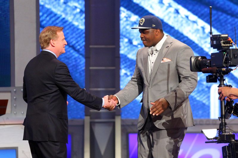 May 8, 2014; New York, NY, USA; Greg Robinson (Auburn) shakes hands with commissioner Roger Goodell after being selected as the number two overall pick in the first round of the 2014 NFL Draft to the St. Louis Rams at Radio City Music Hall. Mandatory Credit: Brad Penner-USA TODAY Sports
