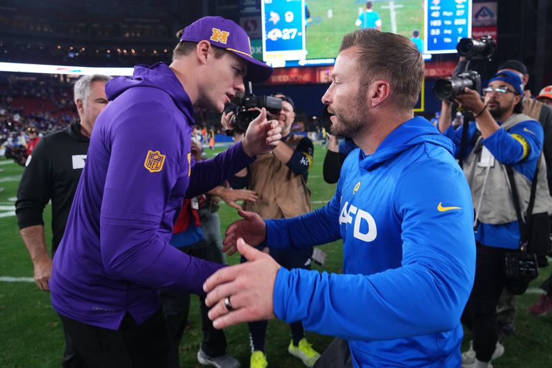 Jan 13, 2025; Glendale, AZ, USA; Minnesota Vikings head coach Kevin O'Connell and Los Angeles Rams head coach Sean McVay shake hands after the NFC wild card game at State Farm Stadium. Mandatory Credit: Joe Camporeale-Imagn Images