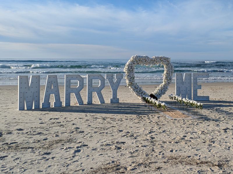 The stage is set for romance as a man gets ready to propose to his girlfriend at a beach on Jan. 10, 2026, in Pacific Grove, Calif.