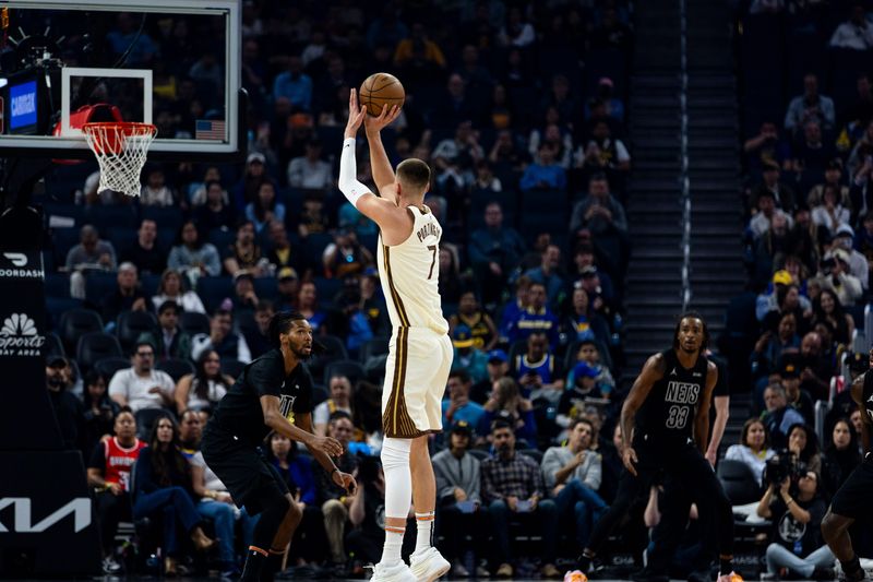 Mar 25, 2026; San Francisco, California, USA; Golden State Warriors center Kristaps Porzingis (7) takes a three-point shot against the Brooklyn Nets during the first quarter at Chase Center. Mandatory Credit: John Hefti-Imagn Images
