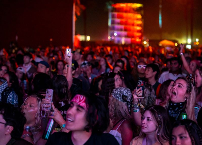 Festivalgoers dance and sing along to Holly Humberstone in the Gobi tent during Weekend 2 of the Coachella Valley Music and Arts Festival in Indio, Calif., Friday, April 17, 2026.