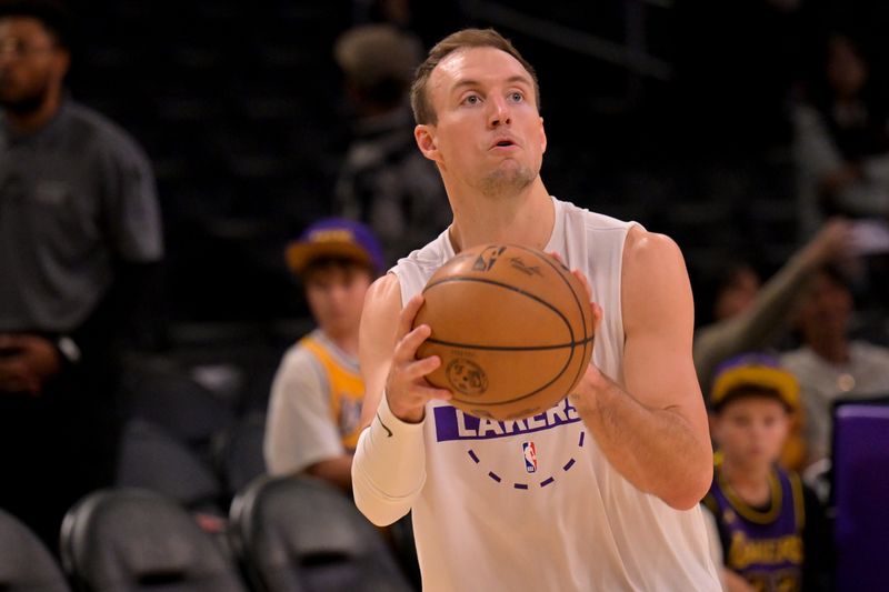 Feb 12, 2026; Los Angeles, California, USA; Los Angeles Lakers guard Luke Kennard (10) warms up prior to the game against the Dallas Mavericks at Crypto.com Arena. Mandatory Credit: Jayne Kamin-Oncea-Imagn Images