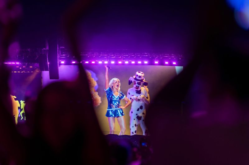 Sabrina Carpenter performs on the Coachella Stage as seen on the big screens at the Coachella Valley Music and Arts Festival in Indio, Calif., on Friday, April 17, 2026.