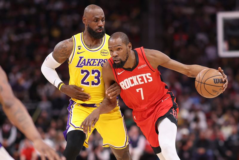 Mar 16, 2026; Houston, Texas, USA; Houston Rockets forward Kevin Durant (7) dribbles the ball as Los Angeles Lakers forward LeBron James (23) defends during the first quarter at Toyota Center. Mandatory Credit: Troy Taormina-Imagn Images