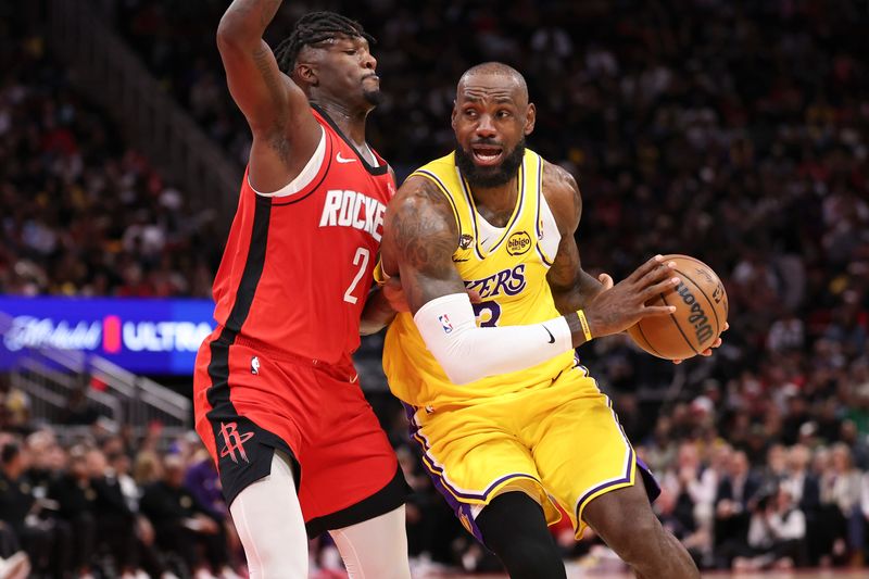 Mar 16, 2026; Houston, Texas, USA; Los Angeles Lakers forward LeBron James (23) drives with the ball as Houston Rockets forward Dorian Finney-Smith (2) defends during the fourth quarter at Toyota Center. Mandatory Credit: Troy Taormina-Imagn Images