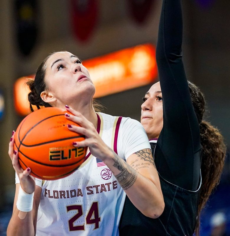 Florida State Seminoles center Pania Davis (24) looks to shoot as Missouri State Bears forward Maiesha Washington (15) guards her during the first quarter of the GEICO Coconut Hoops Tournament Great Egret Division game at Alico Arena on Fort Myers, Fla., on Friday, Nov. 28, 2025.