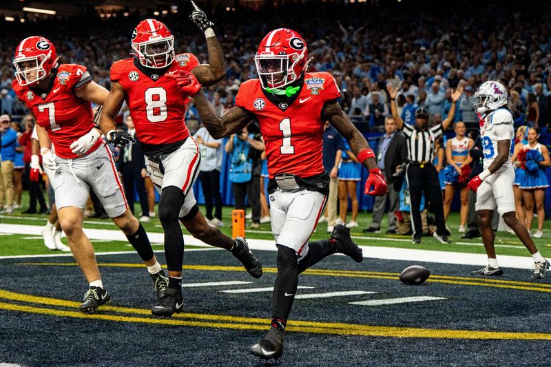 Georgia wide receiver Zachariah Branch (1) celebrates with wide receiver Colbie Young (8) after scoring a touchdown during the Sugar Bowl and College Football Playoff quarterfinals at Caesars Superdome in New Orleans, La., on Thursday, Jan. 1, 2026. Ole Miss defeated Georgia 39-34.