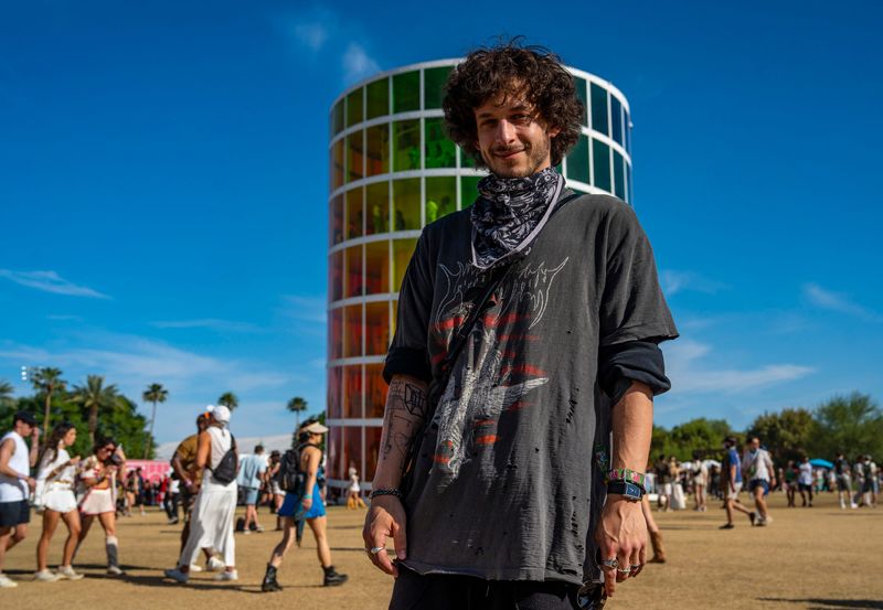 Jesse Kardon, known professionally as Subtronics, poses for a photo in front of the famed Spectra tower during Weekend 2 of the Coachella Valley Music and Arts Festival in Indio, Calif., Sunday, April 19, 2026.