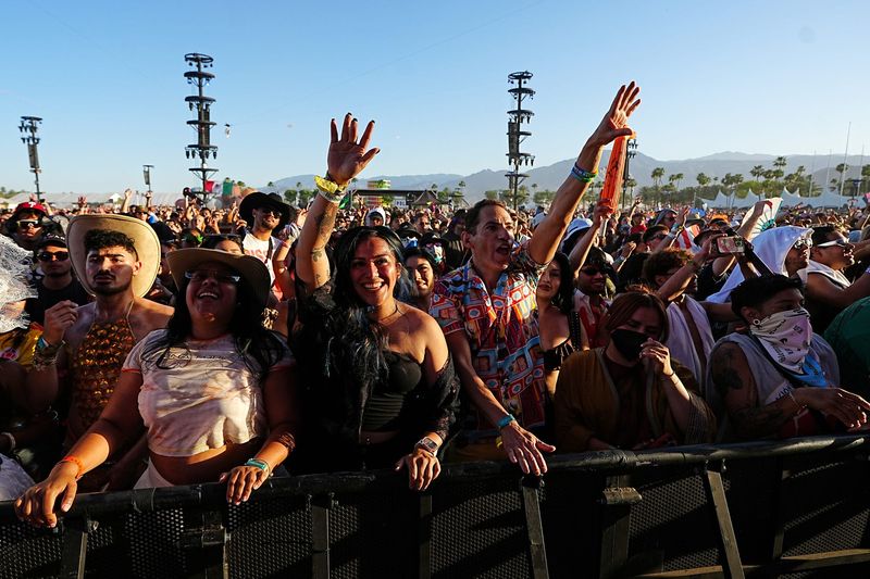 Festivalgoers dance during the late afternoon set by Major Lazer on the Coachella Stage during the Coachella Valley Music and Arts Festival in Indio, Calif., on Sunday, April 19, 2026.