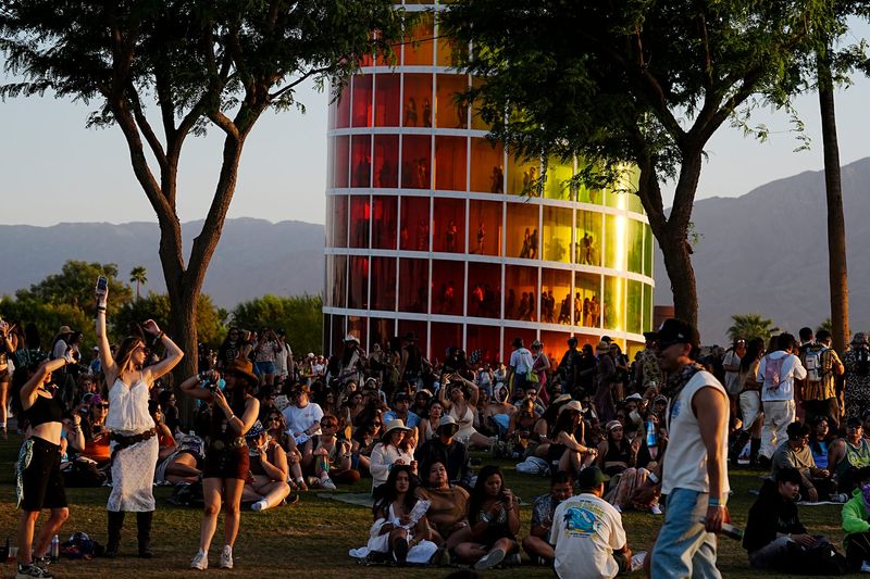 Festivalgoers listen to the Major Lazer late afternoon set during the Major Laser set during the Coachella Valley Music and Arts Festival in Indio, Calif., on Sunday, April 19, 2026.