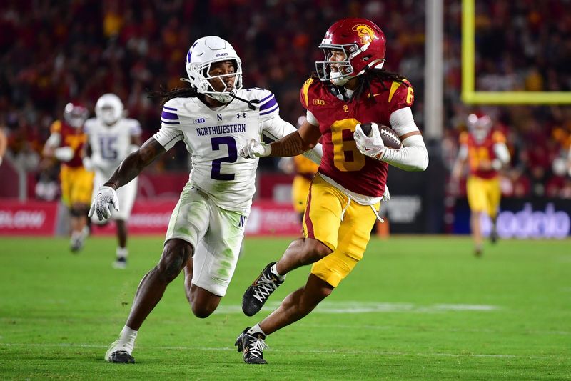 Nov 7, 2025; Los Angeles, California, USA; Southern California Trojans wide receiver Makai Lemon (6) runs the ball against Northwestern Wildcats cornerback Fred Davis II (2) during the second half at the Los Angeles Memorial Coliseum. Mandatory Credit: Gary A. Vasquez-Imagn Images