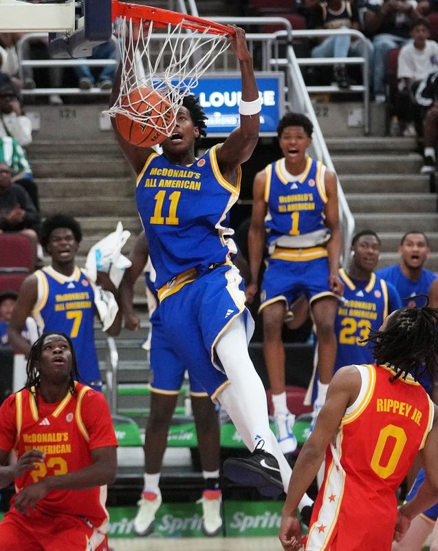 West forward Christian Collins (11) dunks the ball during the McDonald's All-American boys high school basketball game featuring all of the top seniors in the country at Desert Diamond Arena in Glendale, on March 31, 2026.