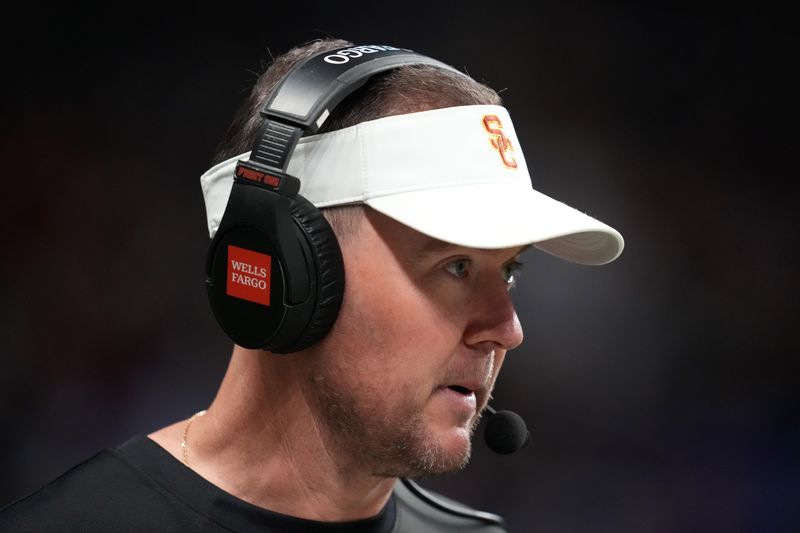 Dec 30, 2025; San Antonio, TX, USA; Southern California Trojans head coach Lincoln Riley watches in the first half against the TCU Horned Frogs during the Alamo Bowl at Alamodome. Mandatory Credit: Kirby Lee-Imagn Images