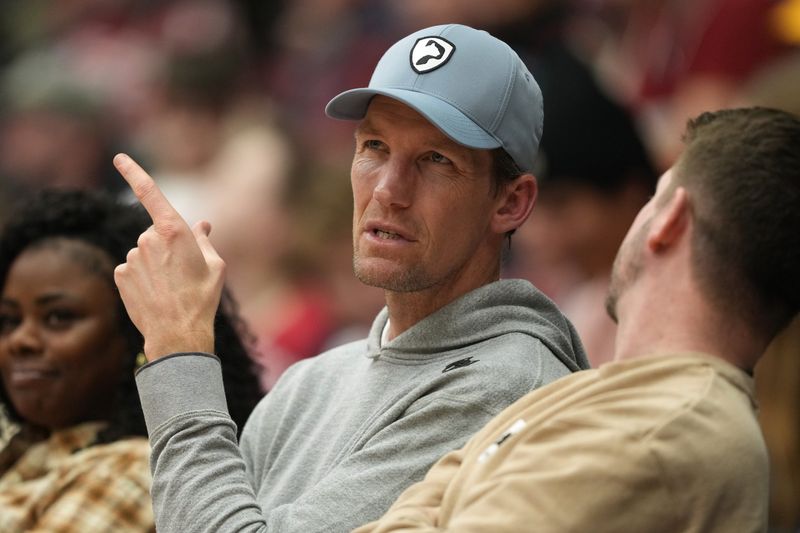 Dec 27, 2025; Stanford, California, USA; Golden State Warriors general manager Mike Dunleavy Jr. sits courtside during the first half of the game between the Stanford Cardinal and the CSUN Matadors at Maples Pavilion. Mandatory Credit: Darren Yamashita-Imagn Images