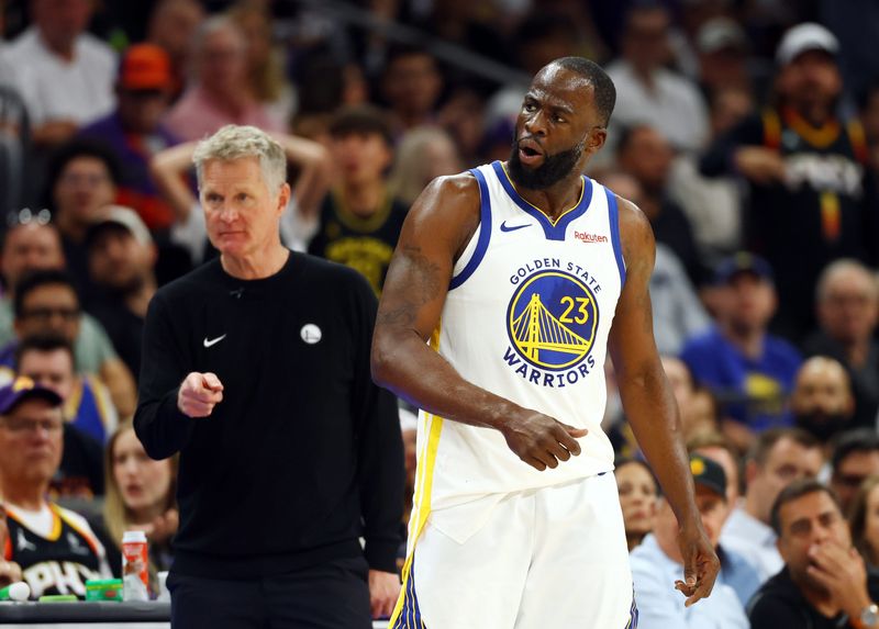 Apr 17, 2026; Phoenix, Arizona, USA; Golden State Warriors forward Draymond Green (23) reacts alongside head coach Steve Kerr against the Phoenix Suns during the second half in the play-in rounds of the 2026 NBA Playoffs at Mortgage Matchup Center. Mandatory Credit: Mark J. Rebilas-Imagn Images