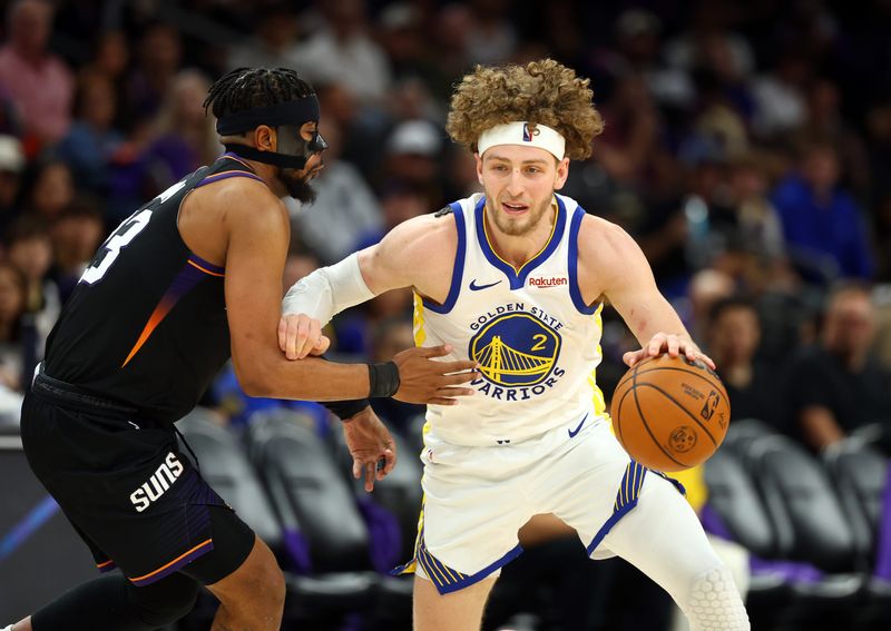 Apr 17, 2026; Phoenix, Arizona, USA; Golden State Warriors guard Brandin Podziemski (2) against Phoenix Suns guard Jordan Goodwin (23) during the play-in rounds of the 2026 NBA Playoffs at Mortgage Matchup Center. Mandatory Credit: Mark J. Rebilas-Imagn Images