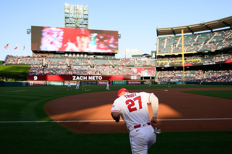 Apr 17, 2026; Anaheim, California, USA; Los Angeles Angels center fielder Mike Trout (27) enters the field before a game against the San Diego Padres at Angel Stadium. Mandatory Credit: William Liang-Imagn Images