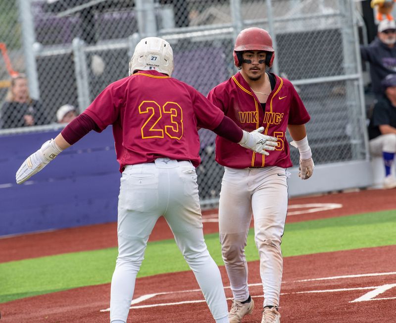 Tokay hosts Edison high for a varsity baseball game Monday April 20. Edison’s Mateo Ceja, left, and Alex Alvarado a score against Tokay.