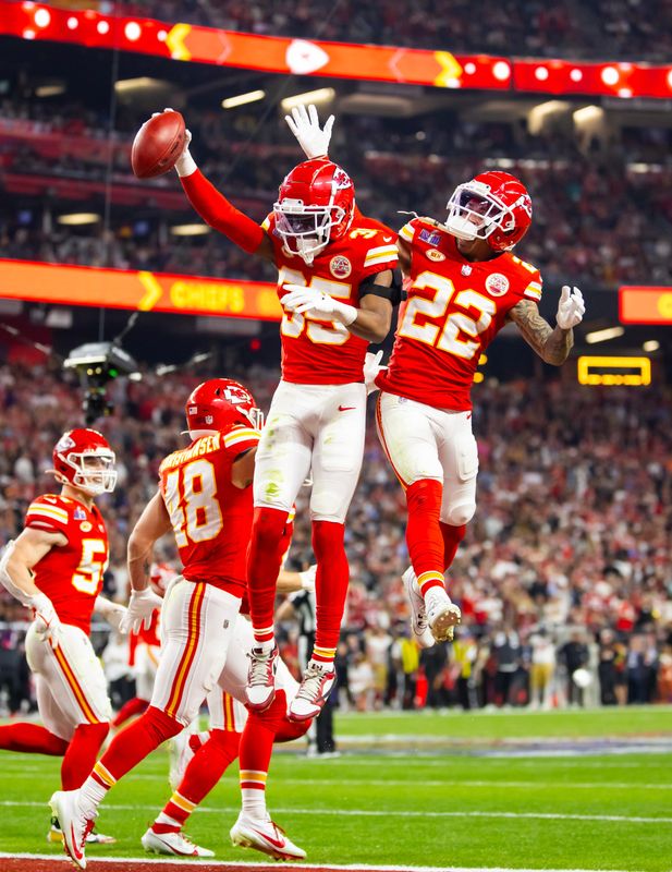 Feb 11, 2024; Paradise, Nevada, USA; Kansas City Chiefs cornerback Jaylen Watson (35) celebrates with Trent McDuffie (22) after recovering a muffed punt against the San Francisco 49ers in the second half in Super Bowl LVIII at Allegiant Stadium. Mandatory Credit: Mark J. Rebilas-USA TODAY Sports