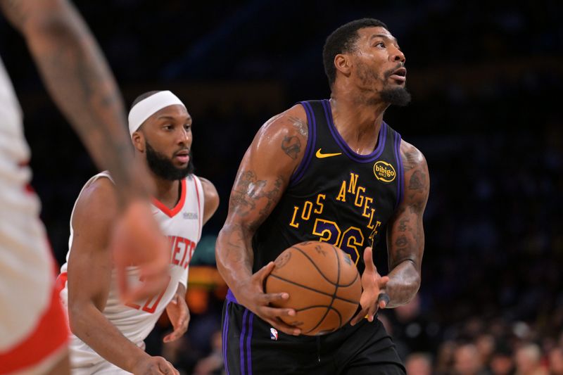 Apr 21, 2026; Los Angeles, California, USA; Los Angeles Lakers guard Marcus Smart (36) drives past Houston Rockets guard Josh Okogie (20) in the first half of game two of the first round of the 2026 NBA Playoffs against the Houston Rockets at Crypto.com Arena. Mandatory Credit: Jayne Kamin-Oncea-Imagn Images