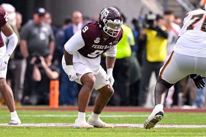 Dec 20, 2025; College Station, TX, USA; Texas A&M Aggies defensive end Cashius Howell (9) lines up during the game between the Aggies and the Hurricanes at Kyle Field. Mandatory Credit: Jerome Miron-Imagn Images
