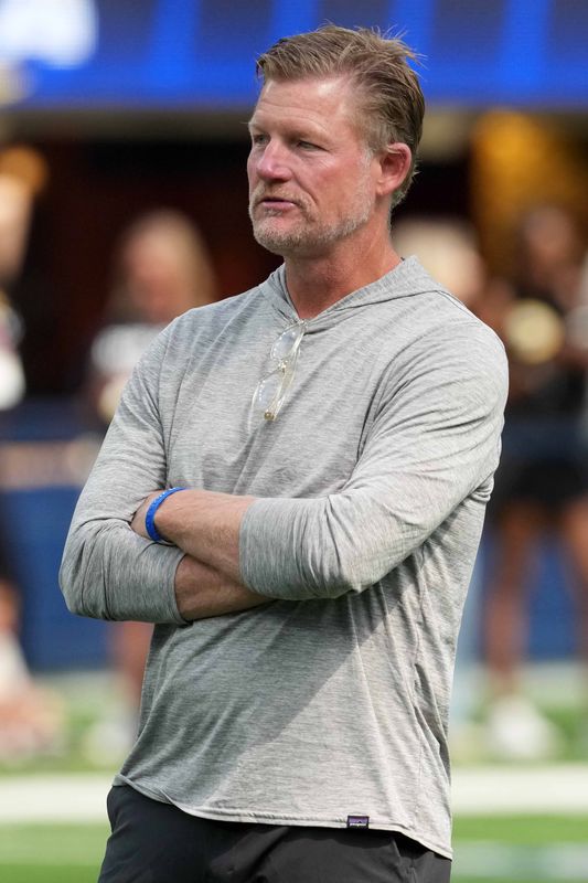 Aug 16, 2025; Inglewood, California, USA; Los Angeles Rams general manager Les Snead watches curing the game Los Angeles Chargers at SoFi Stadium. Mandatory Credit: Kirby Lee-Imagn Images