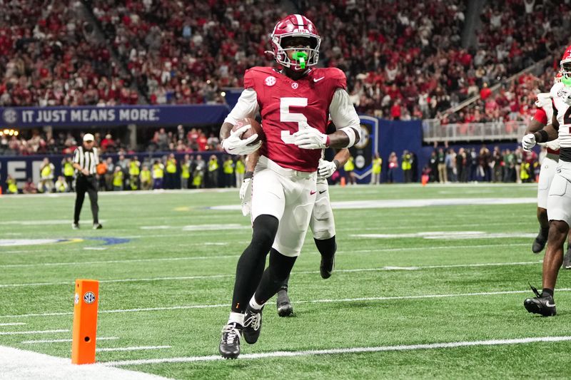 Dec 6, 2025; Atlanta, GA, USA; Alabama Crimson Tide wide receiver Germie Bernard (5) scores a touchdown during the fourth quarter against the Georgia Bulldogs during the 2025 SEC Championship game at Mercedes-Benz Stadium. Mandatory Credit: Dale Zanine-Imagn Images