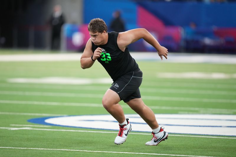 Mar 1, 2026; Indianapolis, IN, USA; Utah offensive lineman Caleb Lomu (OL33) during the NFL Scouting Combine at Lucas Oil Stadium. Mandatory Credit: Kirby Lee-Imagn Images