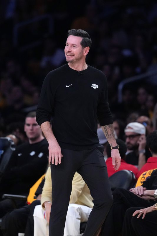 Apr 18, 2026; Los Angeles, California, USA; Los Angeles Lakers head coach JJ Redick reacts during game one of the first round of the 2026 NBA Playoffs against the Houston Rockets at Crypto.com Arena. Mandatory Credit: Kirby Lee-Imagn Images