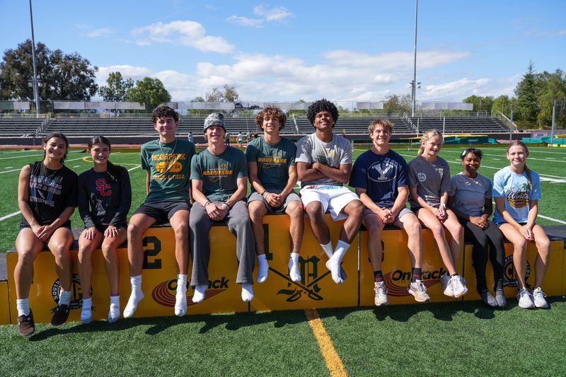 Moorpark High's 10 record-setting track and field athletes this season pose for a photo at an April 22 practice in Moorpark.
