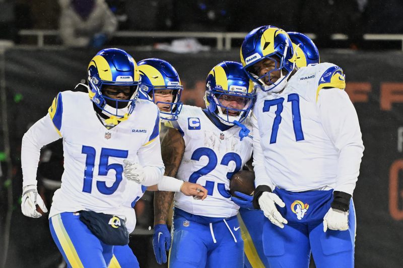 Jan 18, 2026; Chicago, IL, USA; Los Angeles Rams running back Kyren Williams (23) celebrates with wide receiver Konata Mumpfield (15), quarterback Matthew Stafford (9) and offensive tackle Warren McClendon Jr. (71) after scoring a touchdown against the Chicago Bears during the fourth quarter of an NFC Divisional Round game at Soldier Field. Mandatory Credit: Matt Marton-Imagn Images