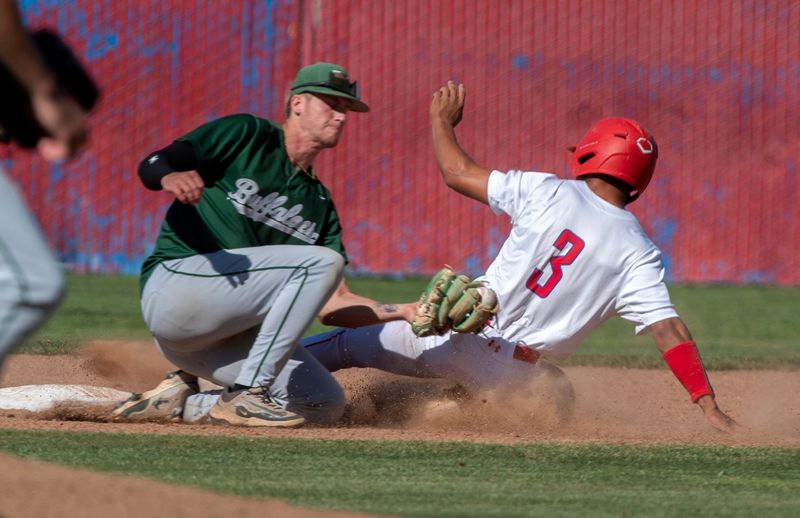 East Union’s Jackson Fay, right, makes it safely to second before Manteca’s Nate Slikker’s during a varsity baseball game at East Union High School in Manteca on Apr. 23, 2026.